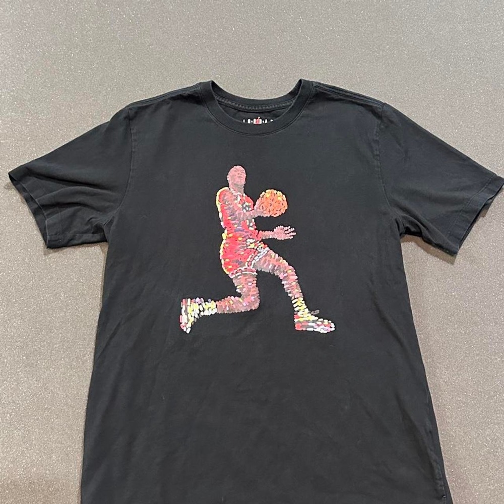 Jordan black t-shirt with graphic of air Jordan in a dunking pose, size M